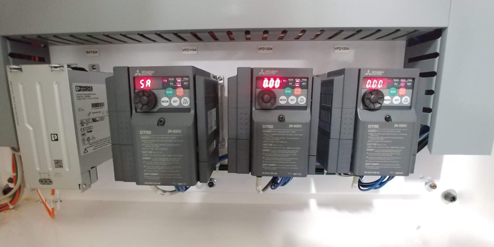 Mitsubishi Variable Frequency Drives mounted in an electrical cabinet
