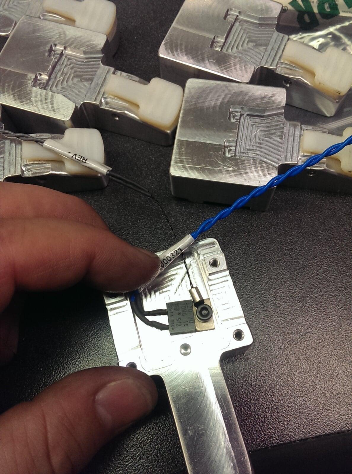 Electrical heating element final wired with a twisted pair wire and ground wire.