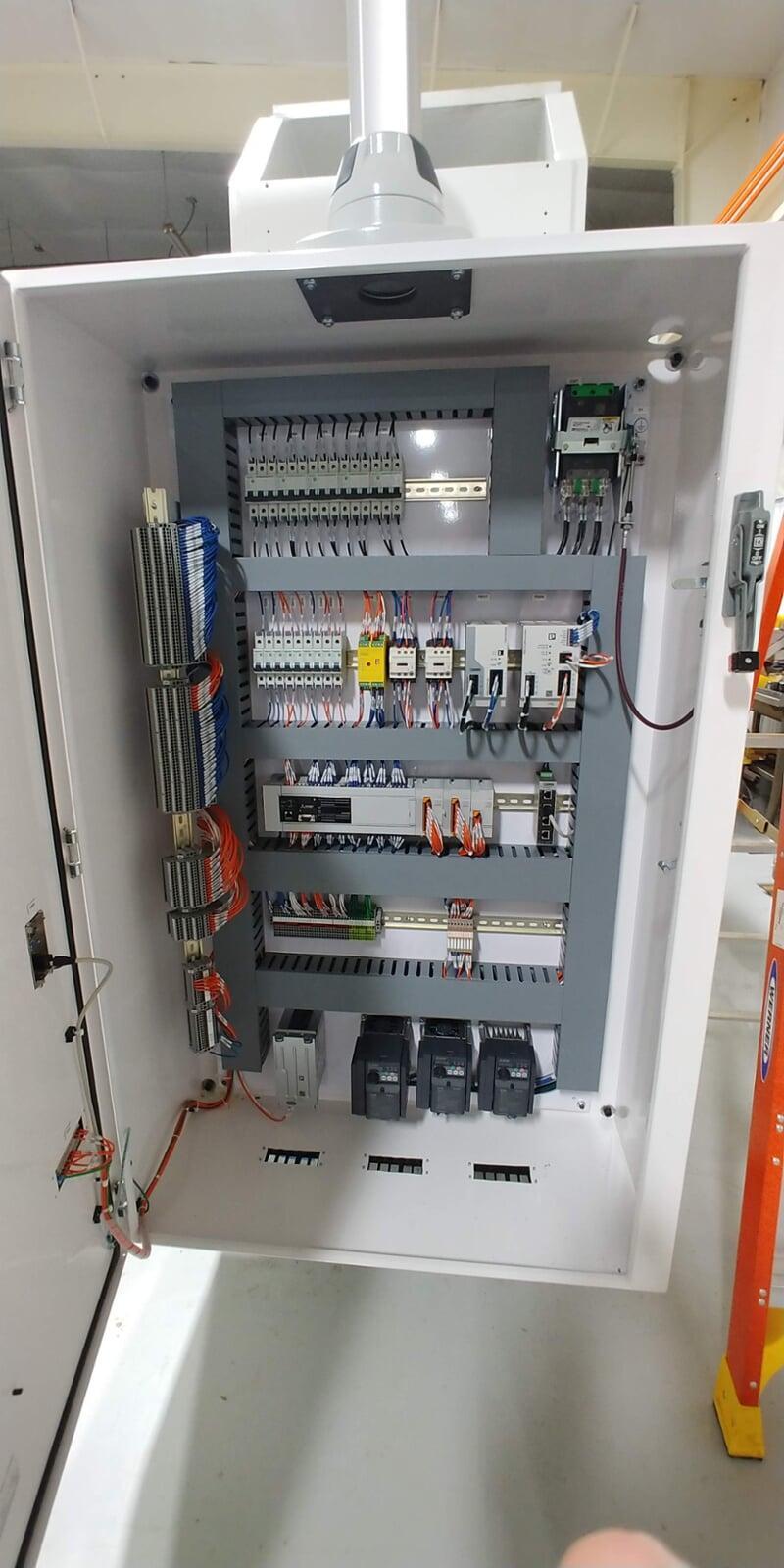 Electrica Cabinet for a press control system. Includes Mitsubishi variable frequency drives and a Mitsubishi PLC
