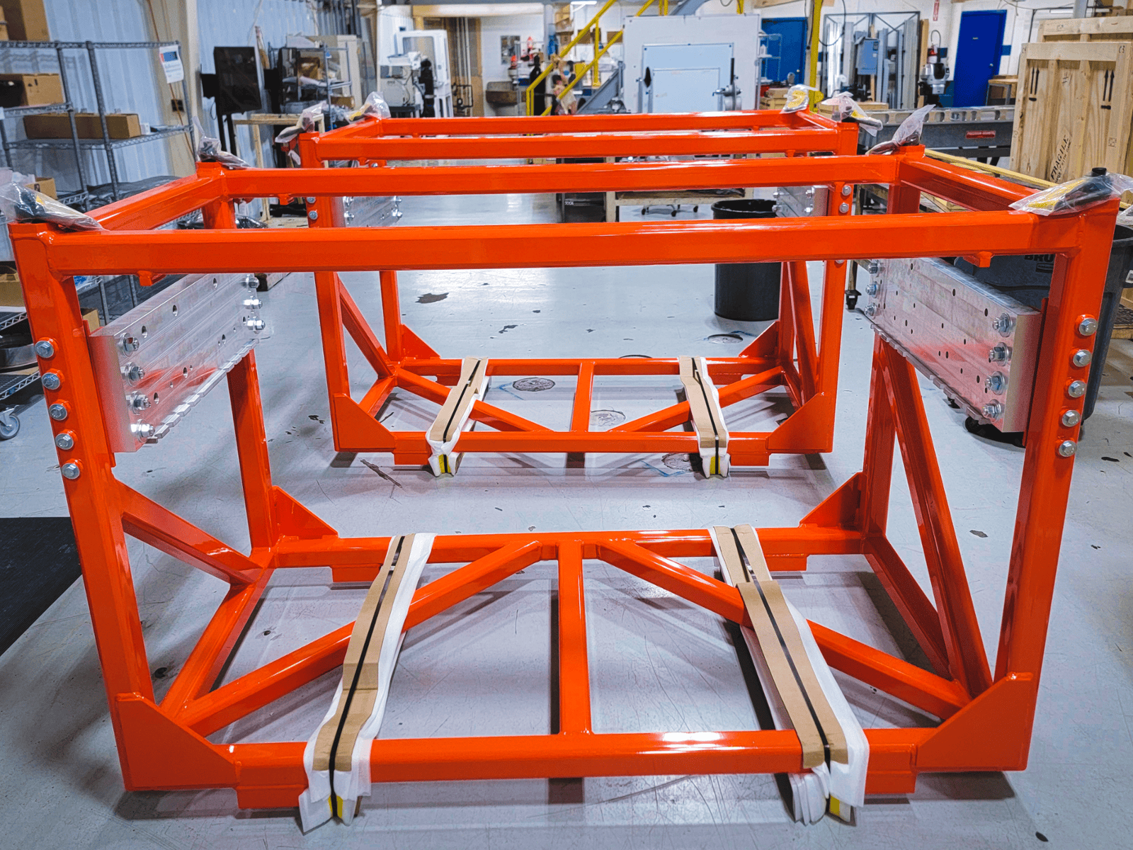 Large tube frame fabrication for a laboratory application. Powder coated bright red-orange and finish assembled