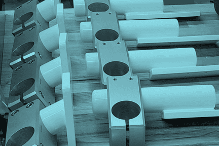 Assembled pipe clamping units for a vision system used in a proton therapy application